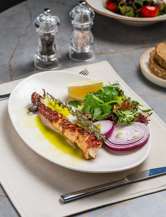 Grilled octopus, fresh greens